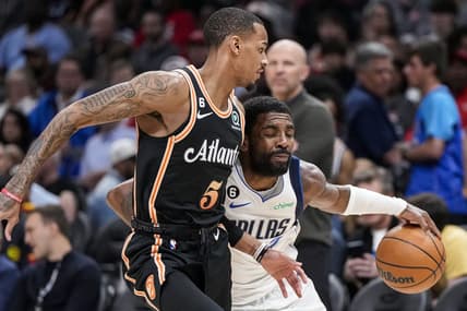 Apr 2, 2023; Atlanta, Georgia, USA; Dallas Mavericks guard Kyrie Irving (2) tries to dribble past Atlanta Hawks guard Dejounte Murray (5) during the first half at State Farm Arena. Mandatory Credit: Dale Zanine-USA TODAY Sports
