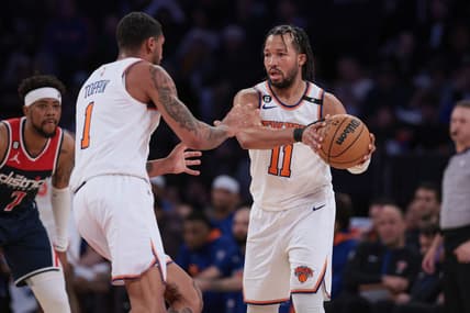 Apr 2, 2023; New York, New York, USA; New York Knicks guard Jalen Brunson (11) sets the ball for forward Obi Toppin (1) in front of Washington Wizards guard Jordan Goodwin (7) during the second half at Madison Square Garden. Mandatory Credit: Vincent Carchietta-USA TODAY Sports