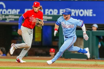 Apr 2, 2023; Arlington, Texas, USA; Texas Rangers right fielder Robbie Grossman (4) rounds first base during the seventh inning against the Philadelphia Phillies at Globe Life Field. Mandatory Credit: Andrew Dieb-USA TODAY Sports