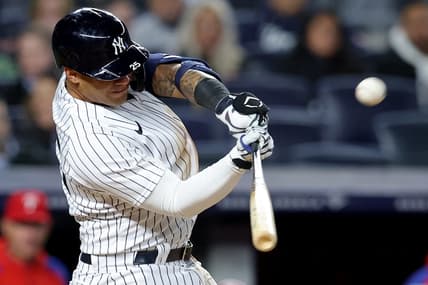 Apr 3, 2023; Bronx, New York, USA; New York Yankees second baseman Gleyber Torres (25) hits a solo home run against the Philadelphia Phillies during the third inning at Yankee Stadium. Mandatory Credit: Brad Penner-USA TODAY Sports
