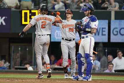 Apr 3, 2023; Arlington, Texas, USA; Baltimore Orioles third base Gunnar Henderson (2) celebrates his solo home run with left fielder Kyle Stowers (28) against the Texas Rangers during the fourth inning at Globe Life Field. Mandatory Credit: Jim Cowsert-USA TODAY Sports