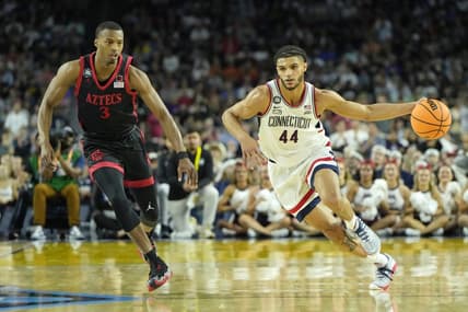 Apr 3, 2023; Houston, TX, USA; Connecticut Huskies guard Andre Jackson Jr. (44) dribbles the ball against San Diego State Aztecs guard Micah Parrish (3) during the first half in the national championship game of the 2023 NCAA Tournament at NRG Stadium. Mandatory Credit: Bob Donnan-USA TODAY Sports