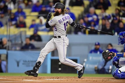 Apr 3, 2023; Los Angeles, California, USA; Colorado Rockies designated hitter Charlie Blackmon (19) reaches first on a fielders choice against the Los Angeles Dodgers during the first inning at Dodger Stadium. Mandatory Credit: Gary A. Vasquez-USA TODAY Sports