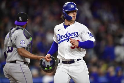 Apr 3, 2023; Los Angeles, California, USA; Los Angeles Dodgers left fielder James Outman (33) scores a run against the Colorado Rockies during the fifth inning at Dodger Stadium. Mandatory Credit: Gary A. Vasquez-USA TODAY Sports
