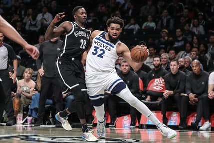 Apr 4, 2023; Brooklyn, New York, USA;  Minnesota Timberwolves center Karl-Anthony Towns (32) looks to drive past Brooklyn Nets forward Dorian Finney-Smith (28) in the first quarter at Barclays Center. Mandatory Credit: Wendell Cruz-USA TODAY Sports