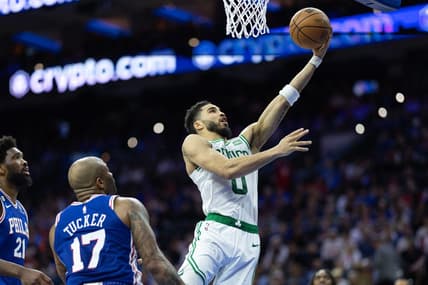 Apr 4, 2023; Philadelphia, Pennsylvania, USA; Boston Celtics forward Jayson Tatum (0) drives for a score past Philadelphia 76ers forward P.J. Tucker (17) and center Joel Embiid (21) during the second quarter at Wells Fargo Center. Mandatory Credit: Bill Streicher-USA TODAY Sports