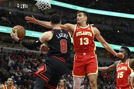 Apr 4, 2023; Chicago, Illinois, USA;  Atlanta Hawks guard Bogdan Bogdanovic (13) defends against Chicago Bulls guard Zach LaVine (8) during the first half at the  United Center. Mandatory Credit: Matt Marton-USA TODAY Sports