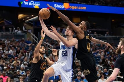 Apr 4, 2023; Orlando, Florida, USA; Orlando Magic forward Franz Wagner (22) shoots the ball against Cleveland Cavaliers forward Evan Mobley (4) in the fourth quarter at Amway Center. Mandatory Credit: Jeremy Reper-USA TODAY Sports
