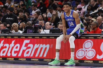 Apr 4, 2023; Washington, District of Columbia, USA; Milwaukee Bucks forward Giannis Antetokounmpo (34) sits on the scorers table against the Washington Wizards in the fourth quarter at Capital One Arena. Mandatory Credit: Geoff Burke-USA TODAY Sports