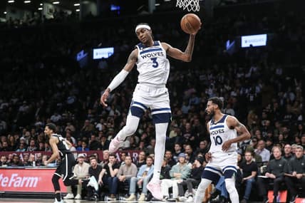 Apr 4, 2023; Brooklyn, New York, USA;  Minnesota Timberwolves forward Jaden McDaniels (3) grabs a rebound in the fourth quarter against the Brooklyn Nets at Barclays Center. Mandatory Credit: Wendell Cruz-USA TODAY Sports