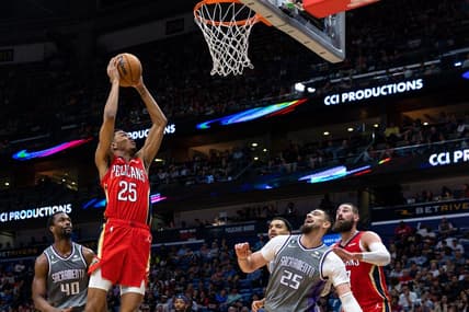 Apr 4, 2023; New Orleans, Louisiana, USA;  New Orleans Pelicans guard Trey Murphy III (25) dunks the ball against Sacramento Kings center Alex Len (25) during the second half at Smoothie King Center. Mandatory Credit: Stephen Lew-USA TODAY Sports
