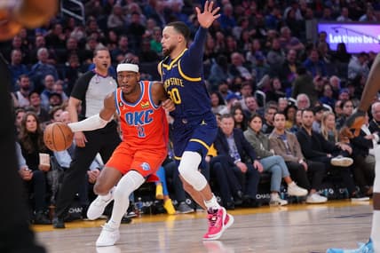 Apr 4, 2023; San Francisco, California, USA; Oklahoma City Thunder guard Shai Gilgeous-Alexander (2) dribbles the ball next to Golden State Warriors guard Stephen Curry (30) in the second quarter at the Chase Center. Mandatory Credit: Cary Edmondson-USA TODAY Sports