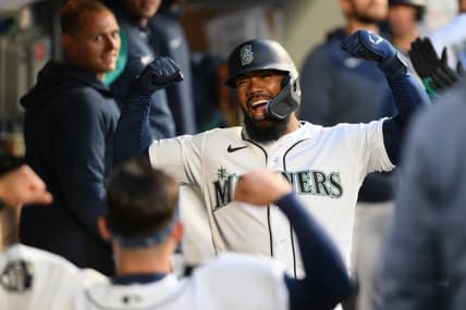 Apr 4, 2023; Seattle, Washington, USA; Seattle Mariners right fielder Teoscar Hernandez celebrates in the dugout after hitting a home run against the Los Angeles Angels during the fourth inning at T-Mobile Park. Mandatory Credit: Steven Bisig-USA TODAY Sports