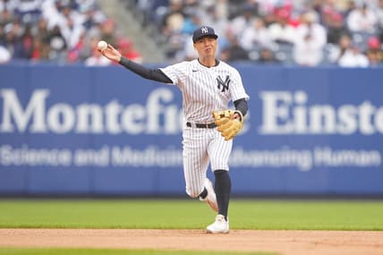 Apr 5, 2023; Bronx, New York, USA; New York Yankees shortstop Anthony Volpe (11) throws out Philadelphia Phillies catcher J.T. Realmuto (10) after fielding a ground ball during the fourth inning at Yankee Stadium. Mandatory Credit: Gregory Fisher-USA TODAY Sports