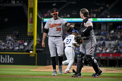 Apr 5, 2023; Arlington, Texas, USA; Baltimore Orioles starting pitcher Grayson Rodriguez (30) and catcher Adley Rutschman (35) come off the field after Rodriguez pitches against the Texas Rangers during the fifth inning at Globe Life Field. Mandatory Credit: Jerome Miron-USA TODAY Sports