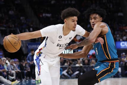 Apr 5, 2023; Detroit, Michigan, USA;  Brooklyn Nets forward Cameron Johnson (2) dribbles on Detroit Pistons guard Jared Rhoden (8) in the first half at Little Caesars Arena. Mandatory Credit: Rick Osentoski-USA TODAY Sports