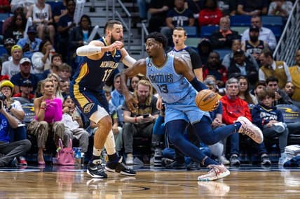 Apr 5, 2023; New Orleans, Louisiana, USA;  Memphis Grizzlies forward Jaren Jackson Jr. (13) dribbles against New Orleans Pelicans center Jonas Valanciunas (17) during the first half at Smoothie King Center. Mandatory Credit: Stephen Lew-USA TODAY Sports