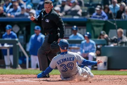 Apr 6, 2023; Kansas City, Missouri, USA; Toronto Blue Jays center fielder Kevin Kiermaier (39) slides into home plate during the second inning against the Kansas City Royals at Kauffman Stadium. Mandatory Credit: William Purnell-USA TODAY Sports