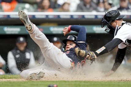 Apr 6, 2023; Detroit, Michigan, USA; Boston Red Sox right fielder Alex Verdugo (99) slides in safe at home ahead of the tag by Detroit Tigers catcher Jake Rogers (34) in the sixth inning at Comerica Park. Mandatory Credit: Rick Osentoski-USA TODAY Sports