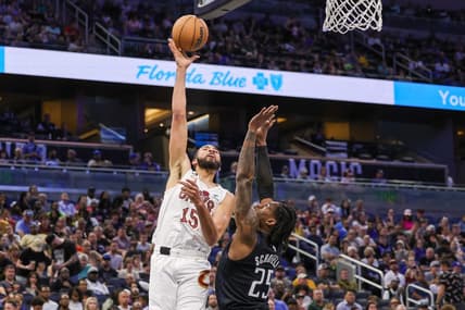 Apr 6, 2023; Orlando, Florida, USA; Cleveland Cavaliers forward Isaiah Mobley (15) shoots the ball over Orlando Magic forward Admiral Schofield (25) during the second quarter at Amway Center. Mandatory Credit: Mike Watters-USA TODAY Sports