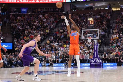 Apr 6, 2023; Salt Lake City, Utah, USA; Oklahoma City Thunder guard Shai Gilgeous-Alexander (2) shoots a three point shot over Utah Jazz forward Kelly Olynyk (41) in the second quarter at Vivint Arena. Mandatory Credit: Rob Gray-USA TODAY Sports