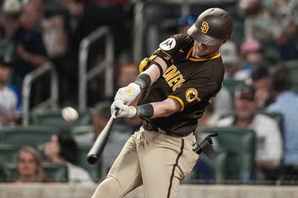 Apr 6, 2023; Cumberland, Georgia, USA; San Diego Padres first baseman Jake Cronenworth (9) hits a home run against the Atlanta Braves during the sixth inning at Truist Park. Mandatory Credit: Dale Zanine-USA TODAY Sports