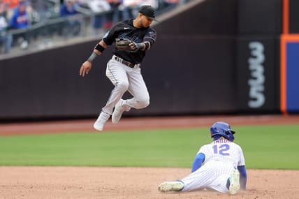Apr 7, 2023; New York City, New York, USA; New York Mets shortstop Francisco Lindor (12) steals second base as the ball goes by Miami Marlins second baseman Luis Arraez (3) allowing Lindor to advance to third during the sixth inning at Citi Field. Mandatory Credit: Brad Penner-USA TODAY Sports