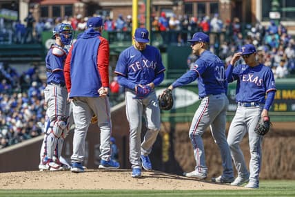Apr 7, 2023; Chicago, Illinois, USA; Texas Rangers starting pitcher Nathan Eovaldi (17) leaves a baseball game against the Chicago Cubs during the sixth inning at Wrigley Field. Mandatory Credit: Kamil Krzaczynski-USA TODAY Sports