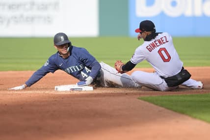 Apr 7, 2023; Cleveland, Ohio, USA; Seattle Mariners center fielder Julio Rodriguez (44) steals second as Cleveland Guardians second baseman Andres Gimenez (0) is late with the tag during the third inning at Progressive Field. Mandatory Credit: Ken Blaze-USA TODAY Sports