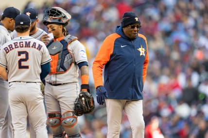 Apr 7, 2023; Minneapolis, Minnesota, USA; Houston Astros manager Dusty Baker Jr. (12) walks back to the dugout after handing Houston Astros relief pitcher Bryan Abreu (52) the ball in the sixth inning at Target Field. Mandatory Credit: Matt Blewett-USA TODAY Sports