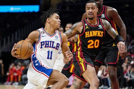 Apr 7, 2023; Atlanta, Georgia, USA; Philadelphia 76ers guard Jaden Springer (11) drives to the basket against Atlanta Hawks forward John Collins (20) during the first half at State Farm Arena. Mandatory Credit: Dale Zanine-USA TODAY Sports