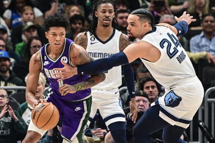 Apr 7, 2023; Milwaukee, Wisconsin, USA; Milwaukee Bucks guard Marjon Beauchamp (0) gets pressure from Memphis Grizzlies guard Dillon Brooks (24) in the first quarter at Fiserv Forum. Mandatory Credit: Benny Sieu-USA TODAY Sports