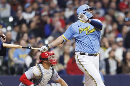 Apr 7, 2023; Milwaukee, Wisconsin, USA;  Milwaukee Brewers first baseman Rowdy Tellez (11) drives in a run with a sacrifice fly ball during the third inning against the St. Louis Cardinals at American Family Field. Mandatory Credit: Jeff Hanisch-USA TODAY Sports