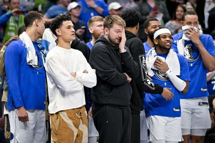 Apr 7, 2023; Dallas, Texas, USA; Dallas Mavericks guard Josh Green (8) and guard Luka Doncic (77) and forward Reggie Bullock (25) and forward Markieff Morris (13) and center JaVale McGee (00) watch the game between the Dallas Mavericks and the Chicago Bulls during the second half at the American Airlines Center. Mandatory Credit: Jerome Miron-USA TODAY Sports