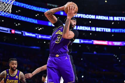 Apr 7, 2023; Los Angeles, California, USA; Los Angeles Lakers forward Anthony Davis (3) gets the rebound against the Phoenix Suns during the second half at Crypto.com Arena. Mandatory Credit: Gary A. Vasquez-USA TODAY Sports