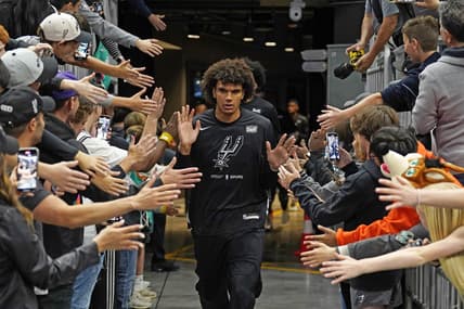 Apr 8, 2023; Austin, Texas, USA; San Antonio Spurs forward Dominick Barlow (26) greets fans on his way to the court before the game against the Minnesota Timberwolves at Moody Center. Mandatory Credit: Scott Wachter-USA TODAY Sports
