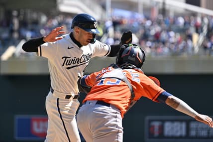 Apr 8, 2023; Minneapolis, Minnesota, USA; Minnesota Twins shortstop Carlos Correa (4) is tagged out at home by Houston Astros catcher Martin Maldonado (15) during the second inning at Target Field. Mandatory Credit: Jeffrey Becker-USA TODAY Sports