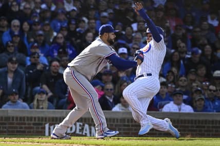 Apr 8, 2023; Chicago, Illinois, USA; Chicago Cubs left fielder Ian Happ (8) is forced out on an attempted steal at home plate by Texas Rangers starting pitcher Martin Perez (54) during the third inning at Wrigley Field. Mandatory Credit: Matt Marton-USA TODAY Sports