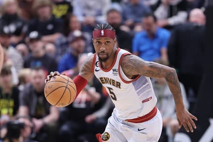 Apr 8, 2023; Salt Lake City, Utah, USA; Denver Nuggets guard Kentavious Caldwell-Pope (5) brings the ball up the court against the Utah Jazz in the first half at Vivint Arena. Mandatory Credit: Rob Gray-USA TODAY Sports