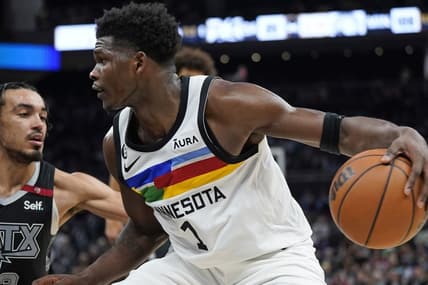 Apr 8, 2023; Austin, Texas, USA; Minnesota Timberwolves guard Anthony Edwards (1) drives to the basket while defended by San Antonio Spurs guard Tre Jones (33) during the second half at Moody Center. Mandatory Credit: Scott Wachter-USA TODAY Sports