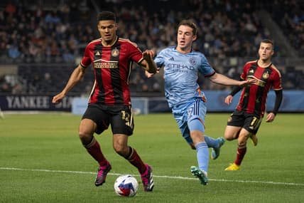 Apr 8, 2023; New York, New York, USA; Atlanta United defender Miles Robinson (12) fights to control the ball against New York City FC forward Gabriel Segal (19) during the first half at Yankee Stadium. Mandatory Credit: Mark Smith-USA TODAY Sports