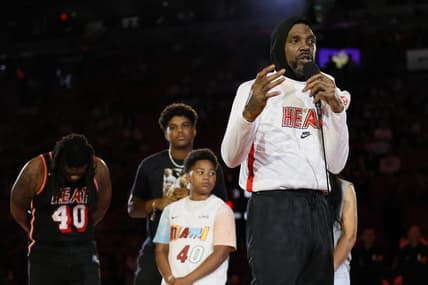 Apr 9, 2023; Miami, Florida, USA; Miami Heat forward Udonis Haslem (40) talks in front of his family during a ceremony to celebrate his last regular season game prior to the game against the Orlando Magic at Kaseya Center. Mandatory Credit: Sam Navarro-USA TODAY Sports