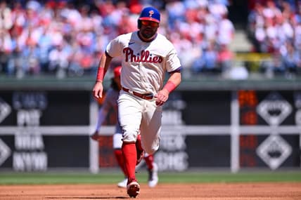 Apr 9, 2023; Philadelphia, Pennsylvania, USA; Philadelphia Phillies outfielder Kyle Schwarber (12) advances toward third to score against the Cincinnati Reds in the first inning at Citizens Bank Park. Mandatory Credit: Kyle Ross-USA TODAY Sports