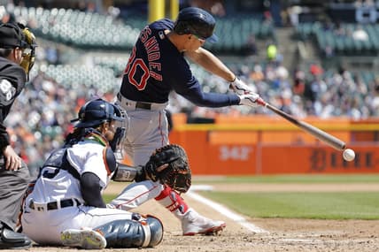 Apr 9, 2023; Detroit, Michigan, USA; Boston Red Sox right fielder Rob Refsnyder (30) hits an RBI single in the fifth inning against the Detroit Tigers at Comerica Park. Mandatory Credit: Rick Osentoski-USA TODAY Sports