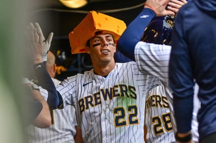 Apr 9, 2023; Milwaukee, Wisconsin, USA; Milwaukee Brewers left fielder Christian Yelich (22) is greeted in the dugout after hitting a solo homer in the seventh inning against the St. Louis Cardinals at American Family Field. Mandatory Credit: Benny Sieu-USA TODAY Sports