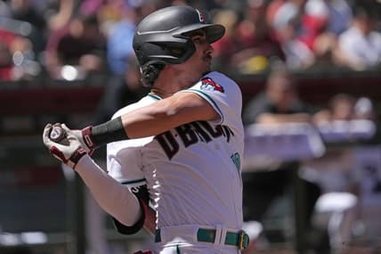 Apr 9, 2023; Phoenix, Arizona, USA; Arizona Diamondbacks third baseman Josh Rojas (10) hits a single against the Los Angeles Dodgers at Chase Field. Mandatory Credit: Joe Camporeale-USA TODAY Sports