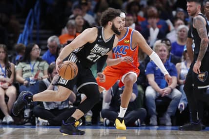 Apr 9, 2023; Oklahoma City, Oklahoma, USA; Memphis Grizzlies forward David Roddy (27) drives to the basket against Oklahoma City Thunder forward Ousmane Dieng (13) during the first half at Paycom Center. Mandatory Credit: Alonzo Adams-USA TODAY Sports