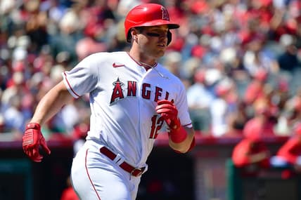 Apr 9, 2023; Anaheim, California, USA; Los Angeles Angels right fielder Hunter Renfroe (12) reaches first on a single against the Toronto Blue Jays during the third inning at Angel Stadium. Mandatory Credit: Gary A. Vasquez-USA TODAY Sports