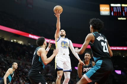 Apr 9, 2023; Portland, Oregon, USA; Golden State Warriors point guard Stephen Curry (30) shoots the ball against Portland Trail Blazers guard Skylar Mays (8, left) and  forward John Butler Jr. (21) during the first half at Moda Center. Mandatory Credit: Soobum Im-USA TODAY Sports