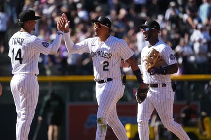 Apr 9, 2023; Denver, Colorado, USA; Colorado Rockies shortstop Ezequiel Tovar (14) and center fielder Yonathan Daza (2) and left fielder Jurickson Profar (29) celebrate defeating the Washington Nationals at Coors Field. Mandatory Credit: Ron Chenoy-USA TODAY Sports